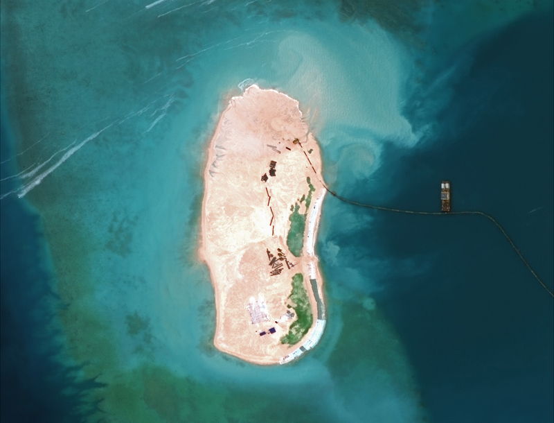 Illustration for article titled Incredible Satellite Images Show China Building Artificial Archipelago